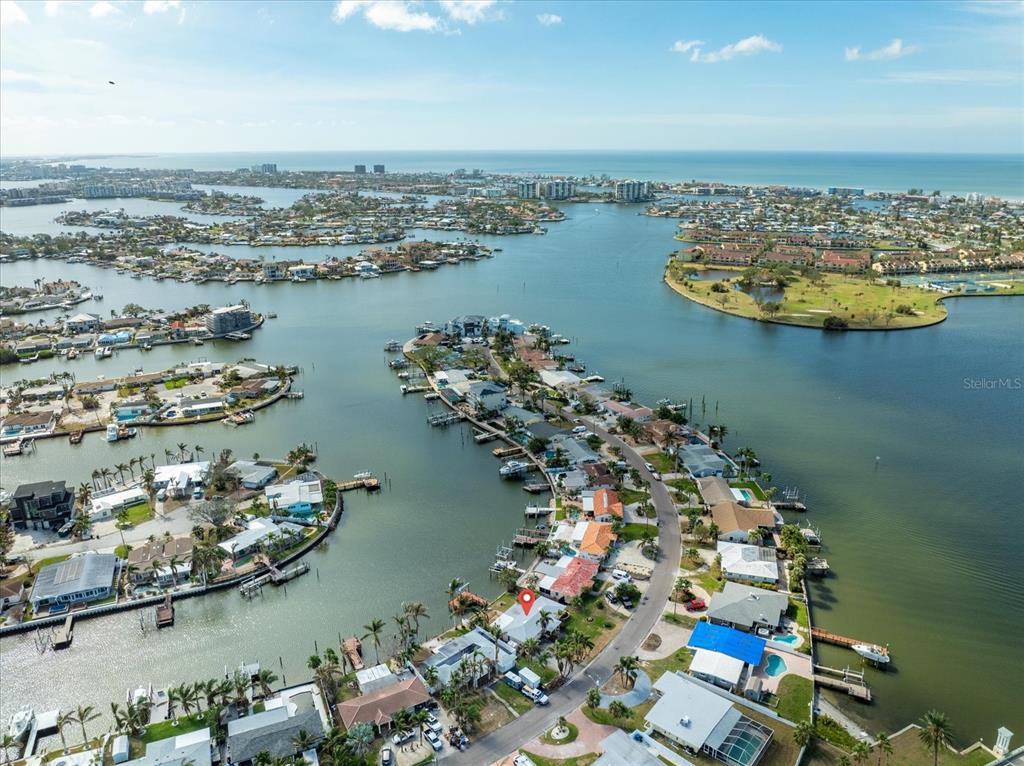 an aerial view of a house with a lake view