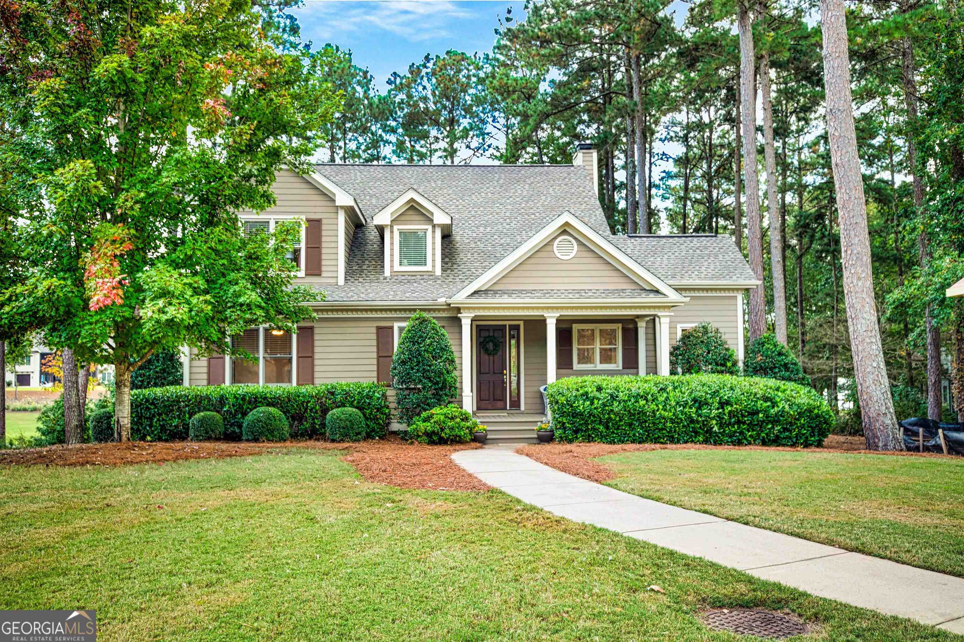 a front view of a house with a yard