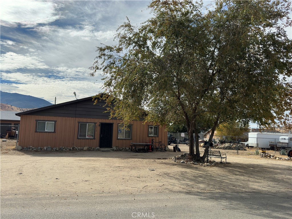 a house with trees in the background