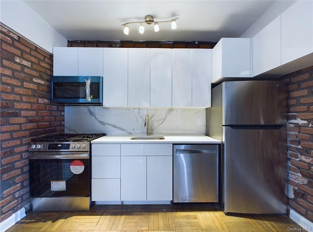 a kitchen with a stove and a refrigerator