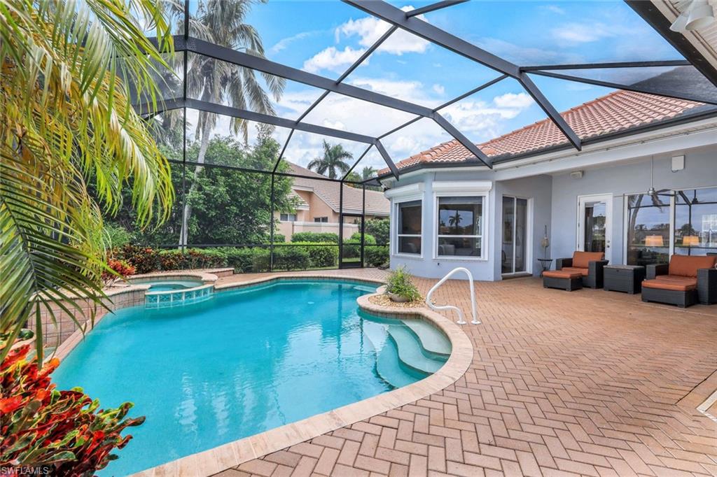 a view of swimming pool with outdoor seating