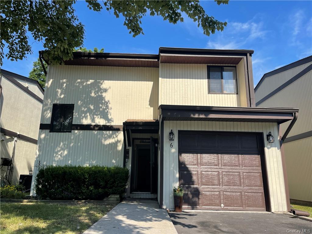 View of front of property with a garage