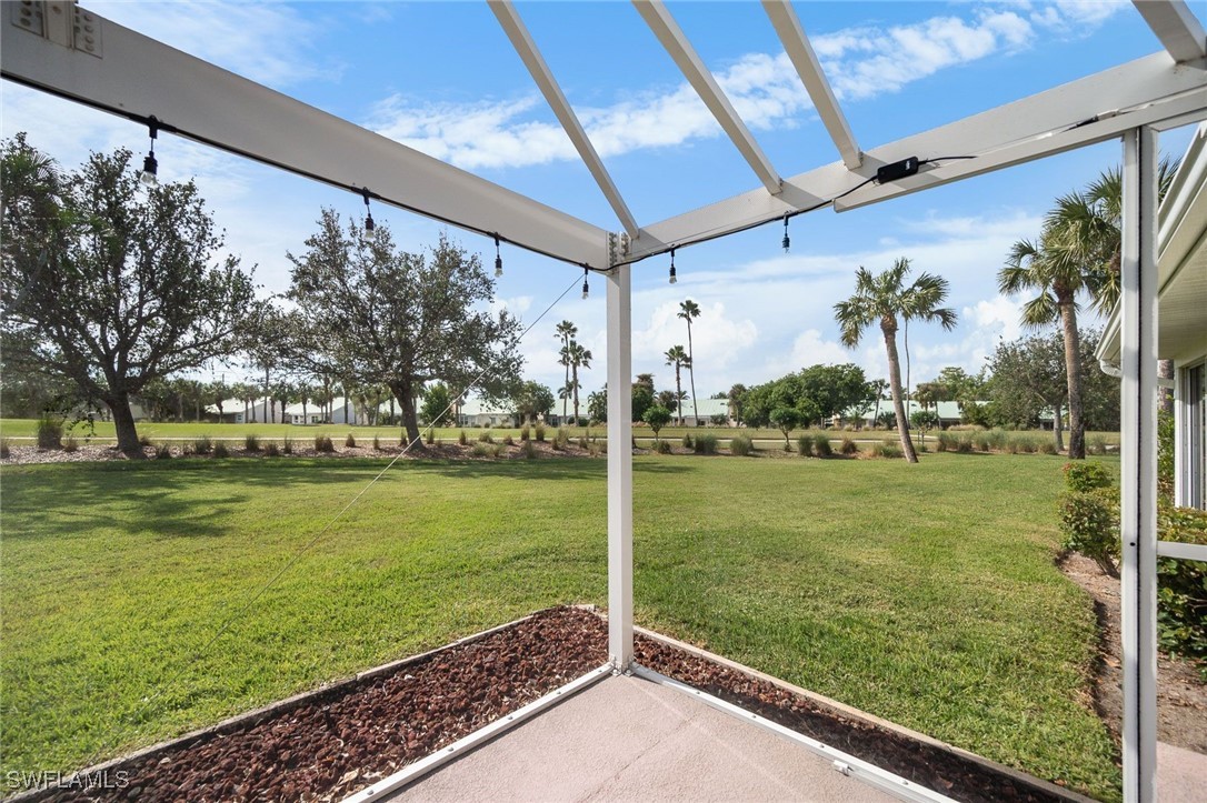 a view of a patio with a yard