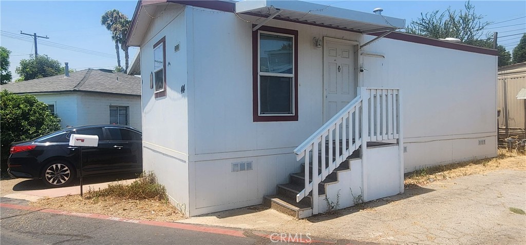 a view of a house with a door and a window