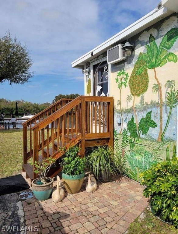 a view of a chairs and table in patio with potted plants