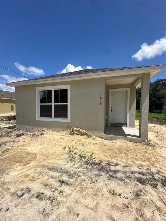 a view of a backyard of a house