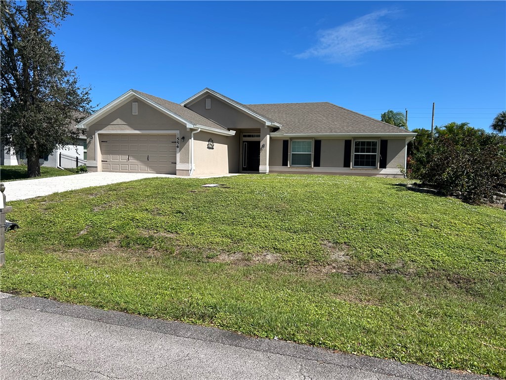 a front view of a house with yard