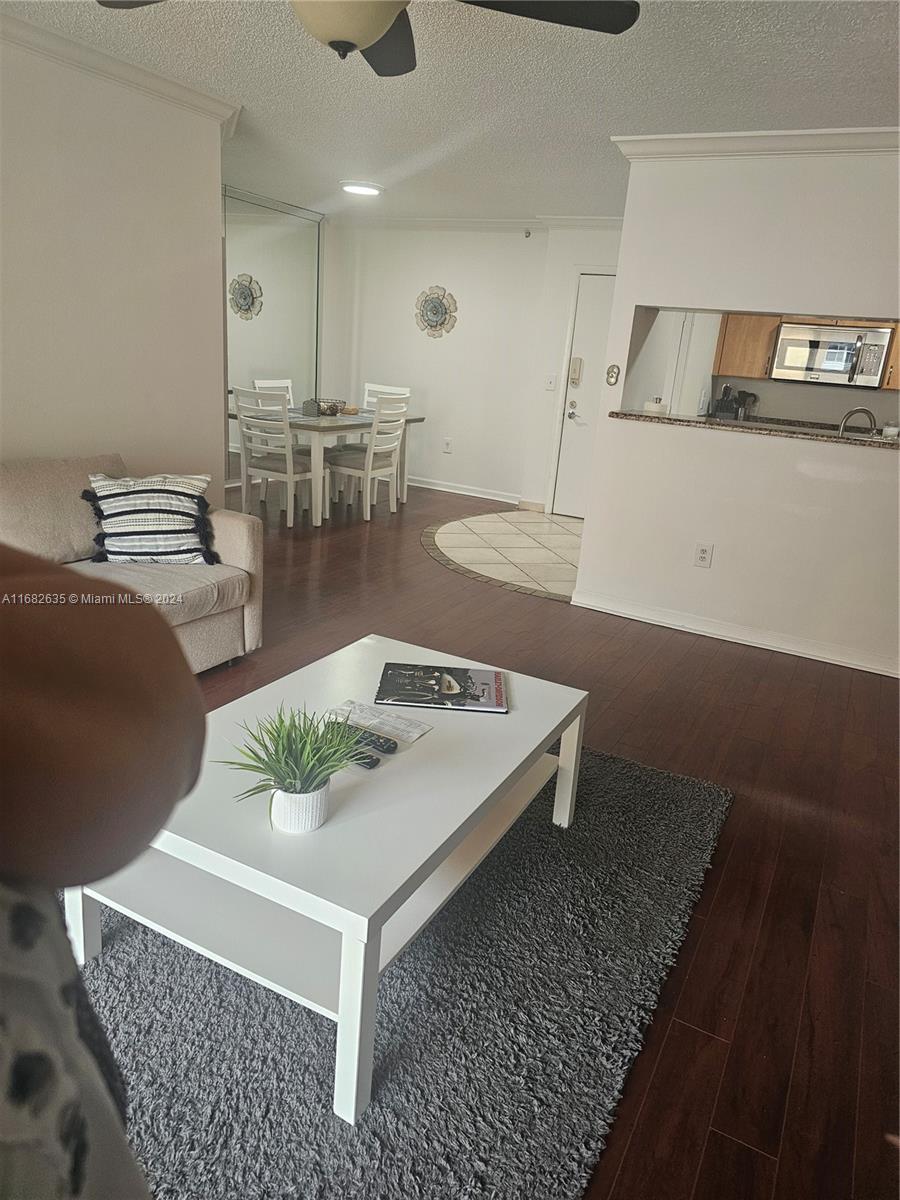 a living room with furniture and white table