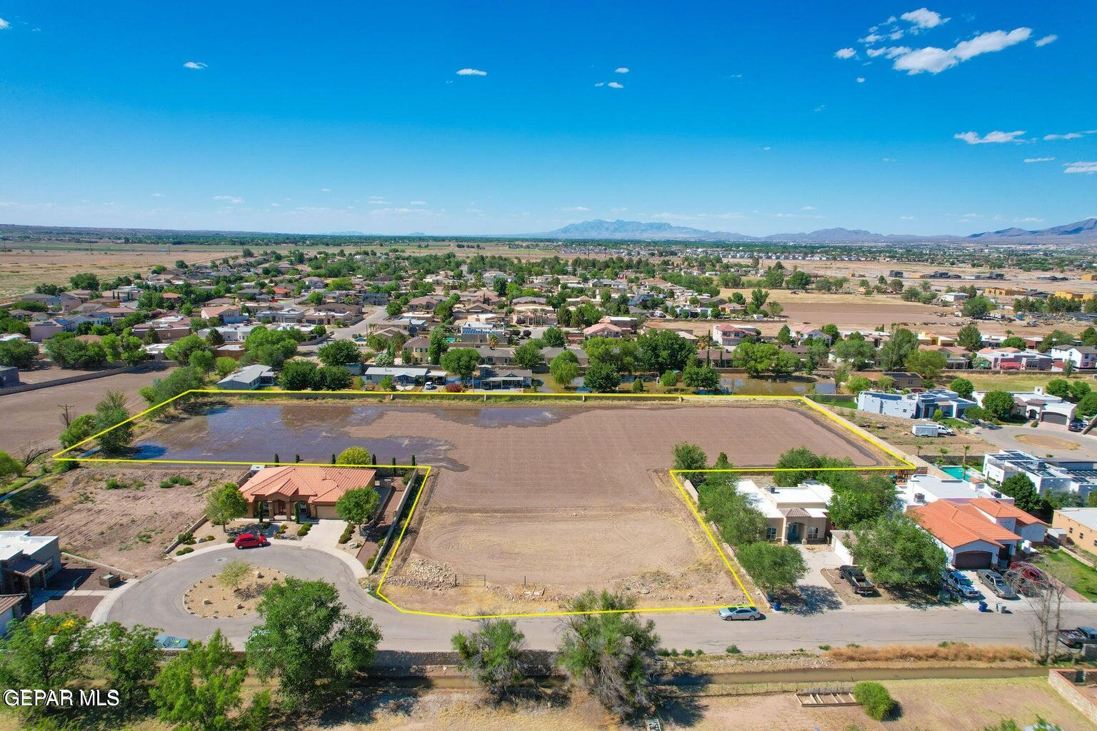 an aerial view of a house with a lake view