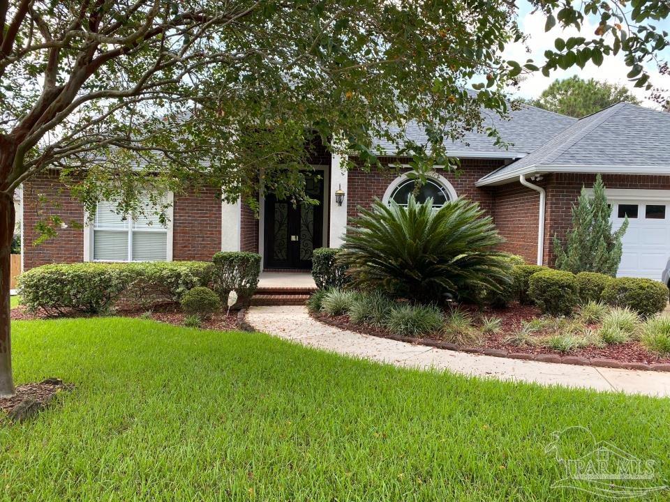 a view of a house with a yard