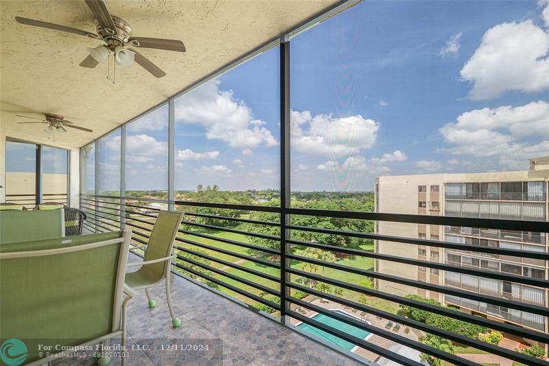 a view of a balcony with furniture