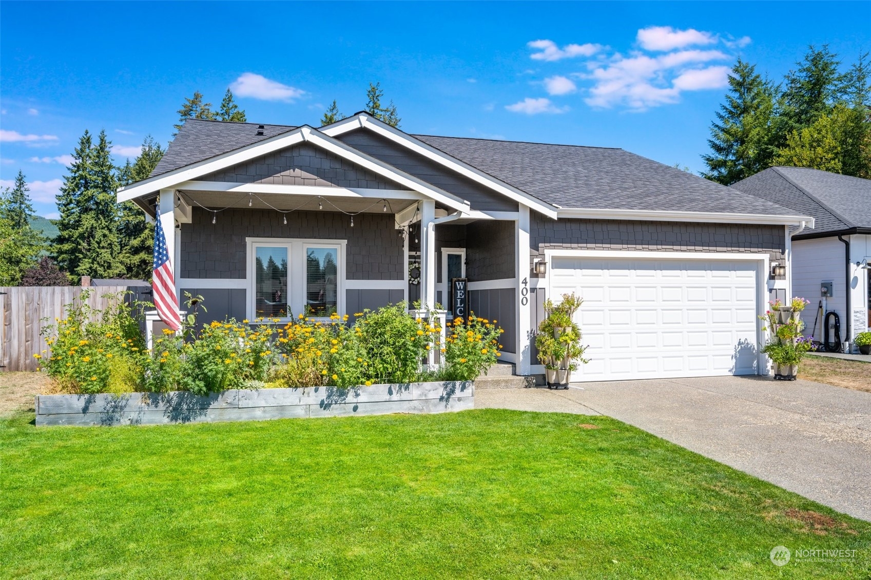 a front view of a house with a yard and garage