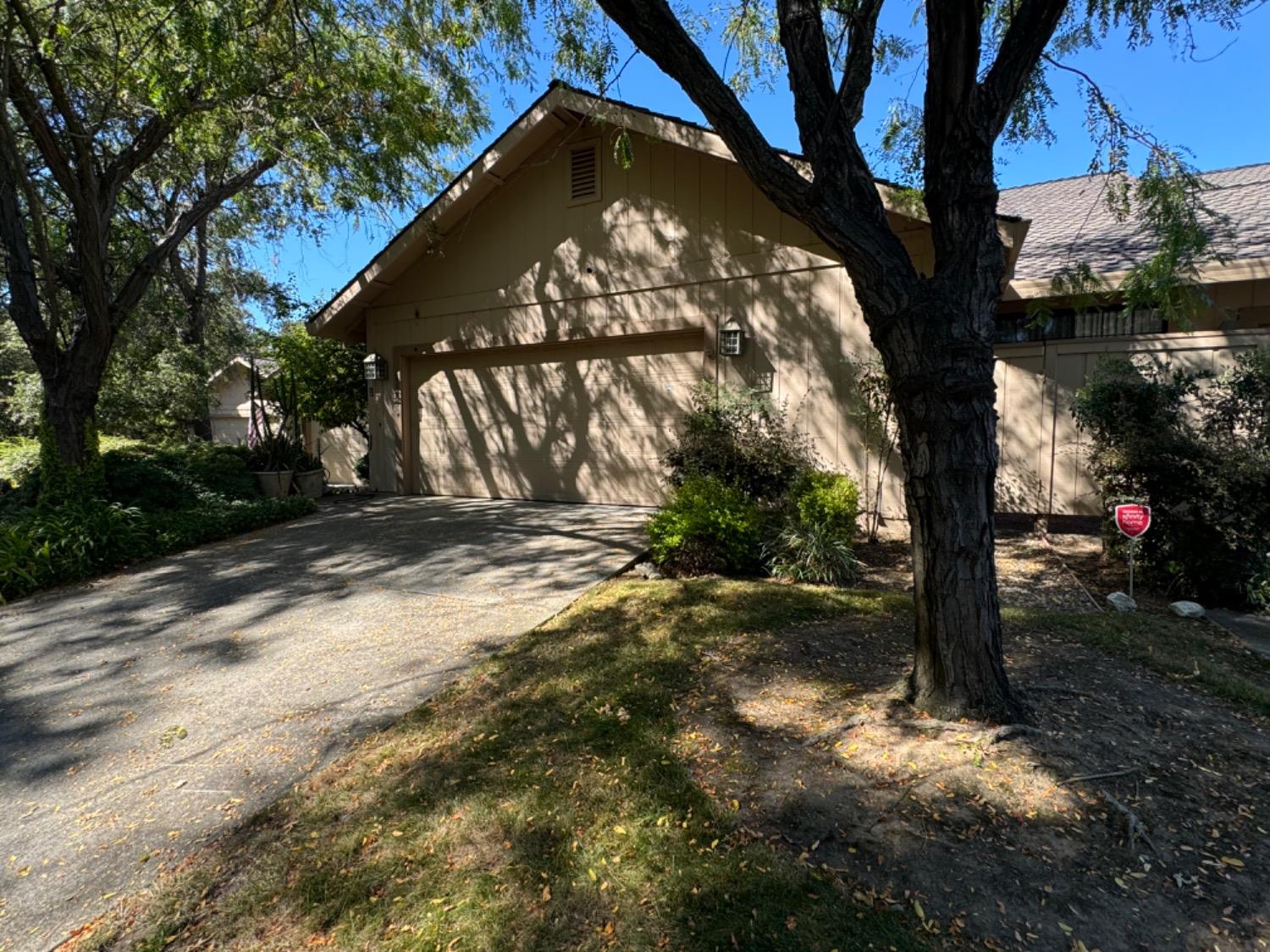 a view of tree in front of a house