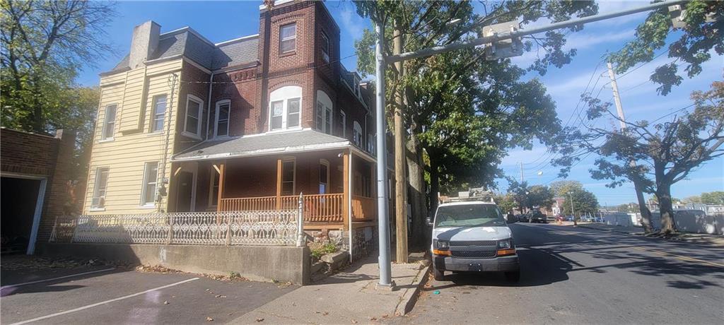 a front view of a house with parking area