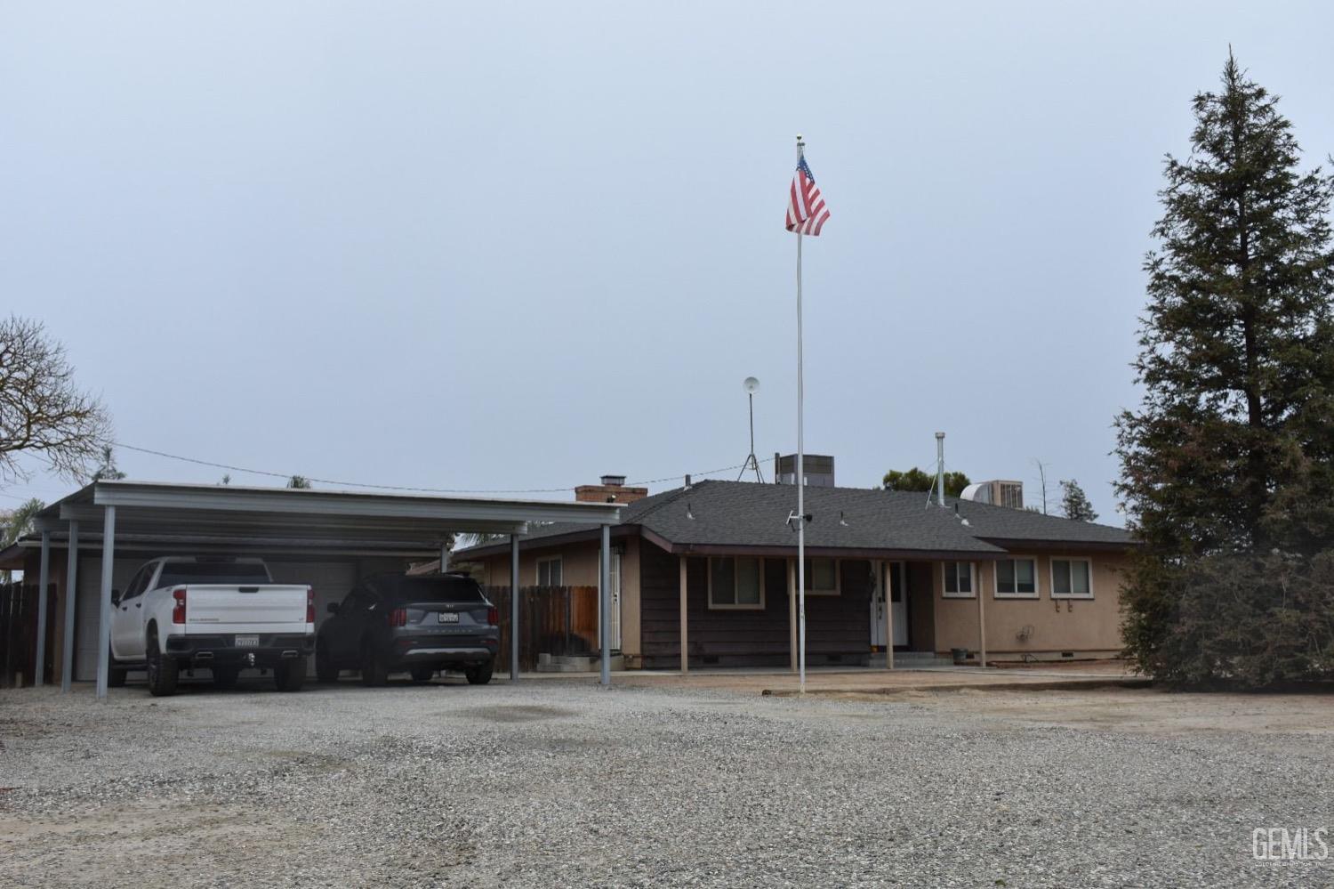 a view of a car park in front of house