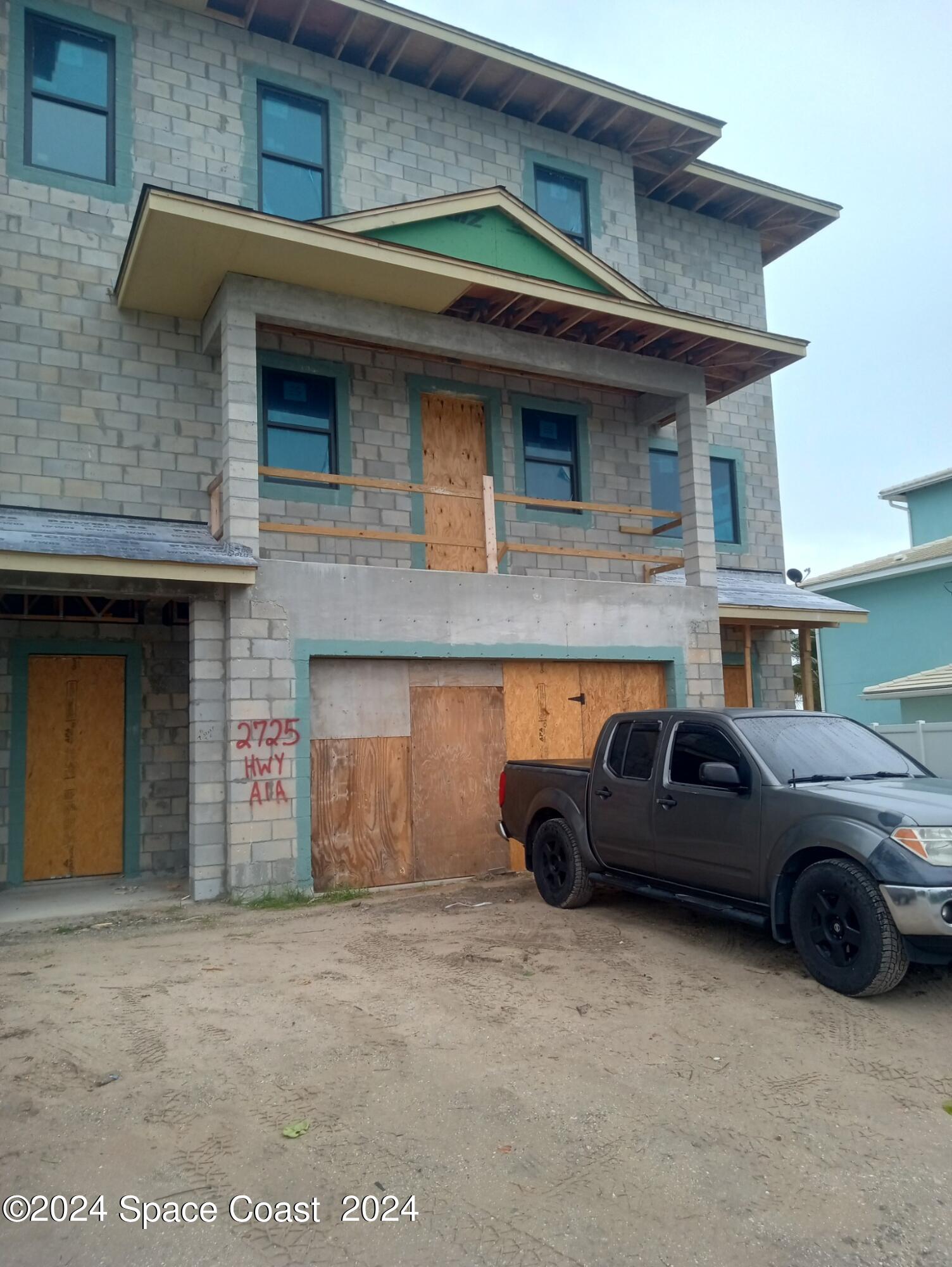 a view of a car parked in front of a building