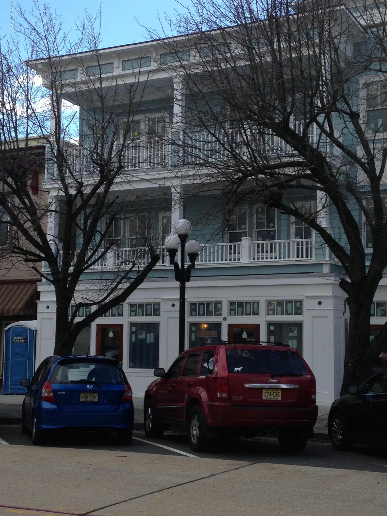 a view of a car parked in front of a building