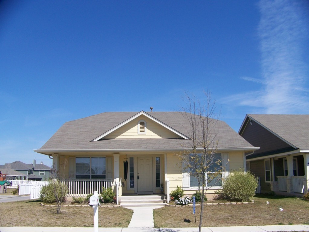 a front view of a house with a porch