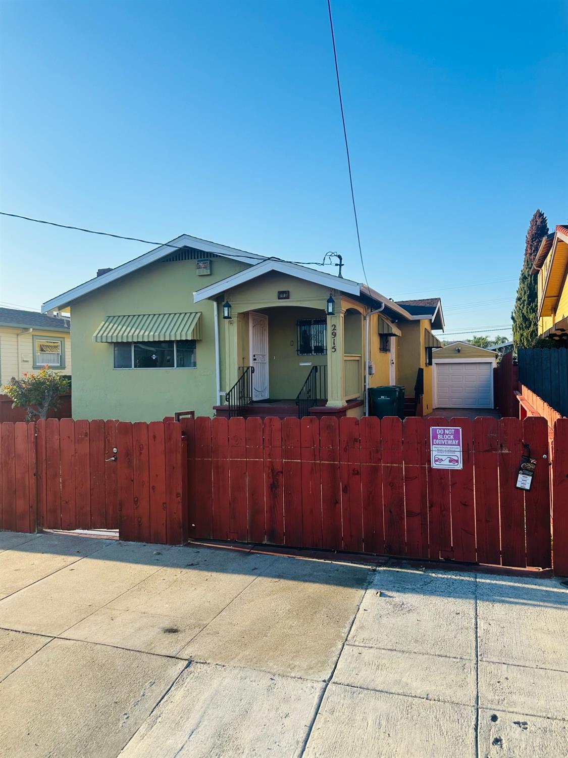 a view of a house with wooden fence