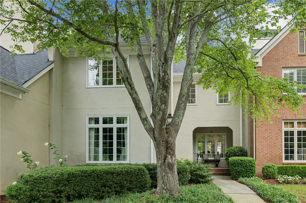 front view of a house with a garden