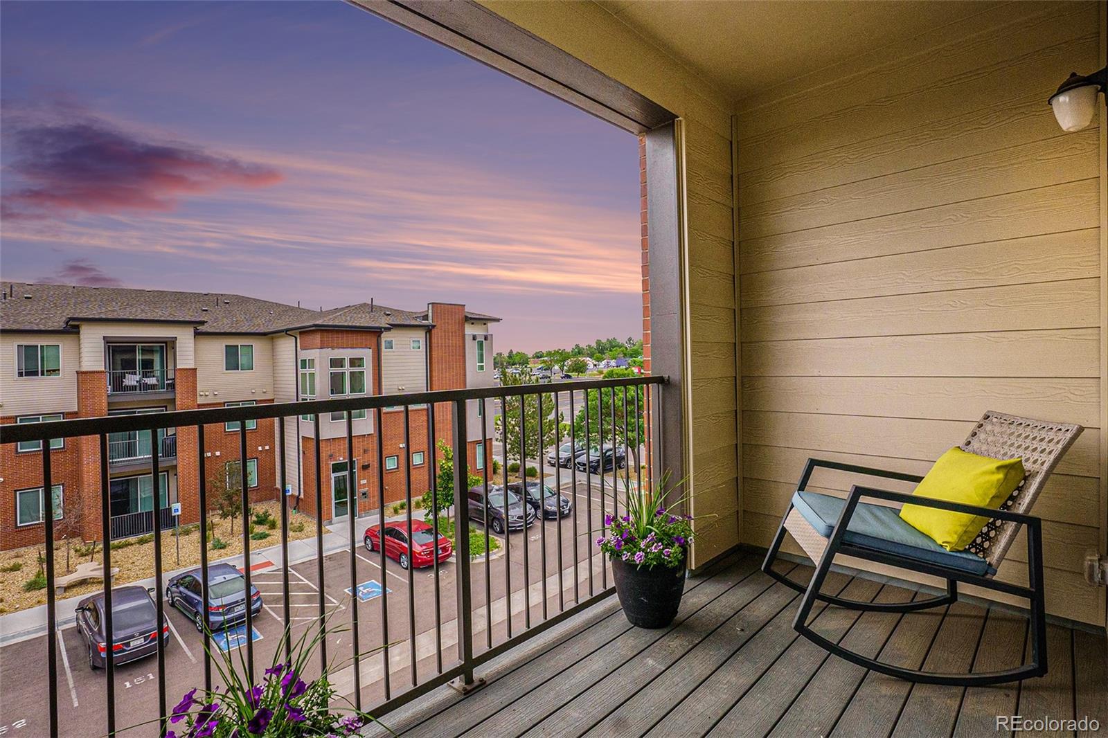 a view of a balcony with wooden floor