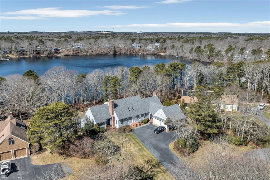 an aerial view of a house with a lake view