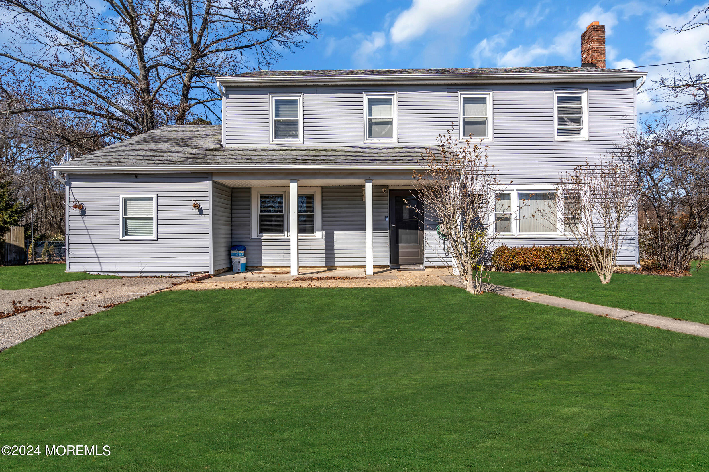 a view of a house with a backyard