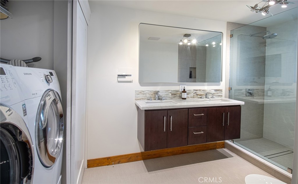 a bathroom with a sink vanity and mirror