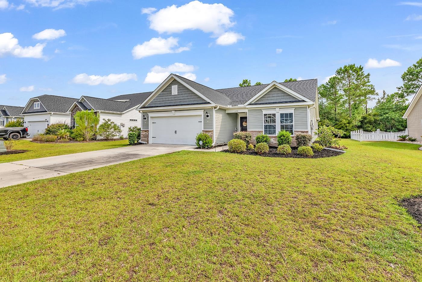 View of front of house featuring a garage and a fr