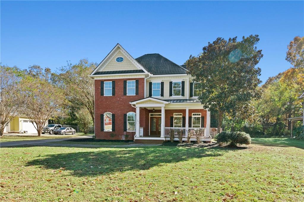 a front view of a house with a yard