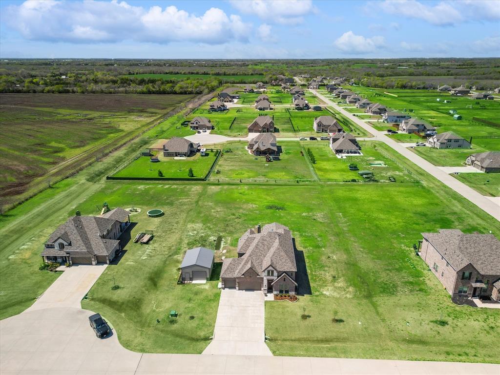 an aerial view of multiple houses with outdoor space