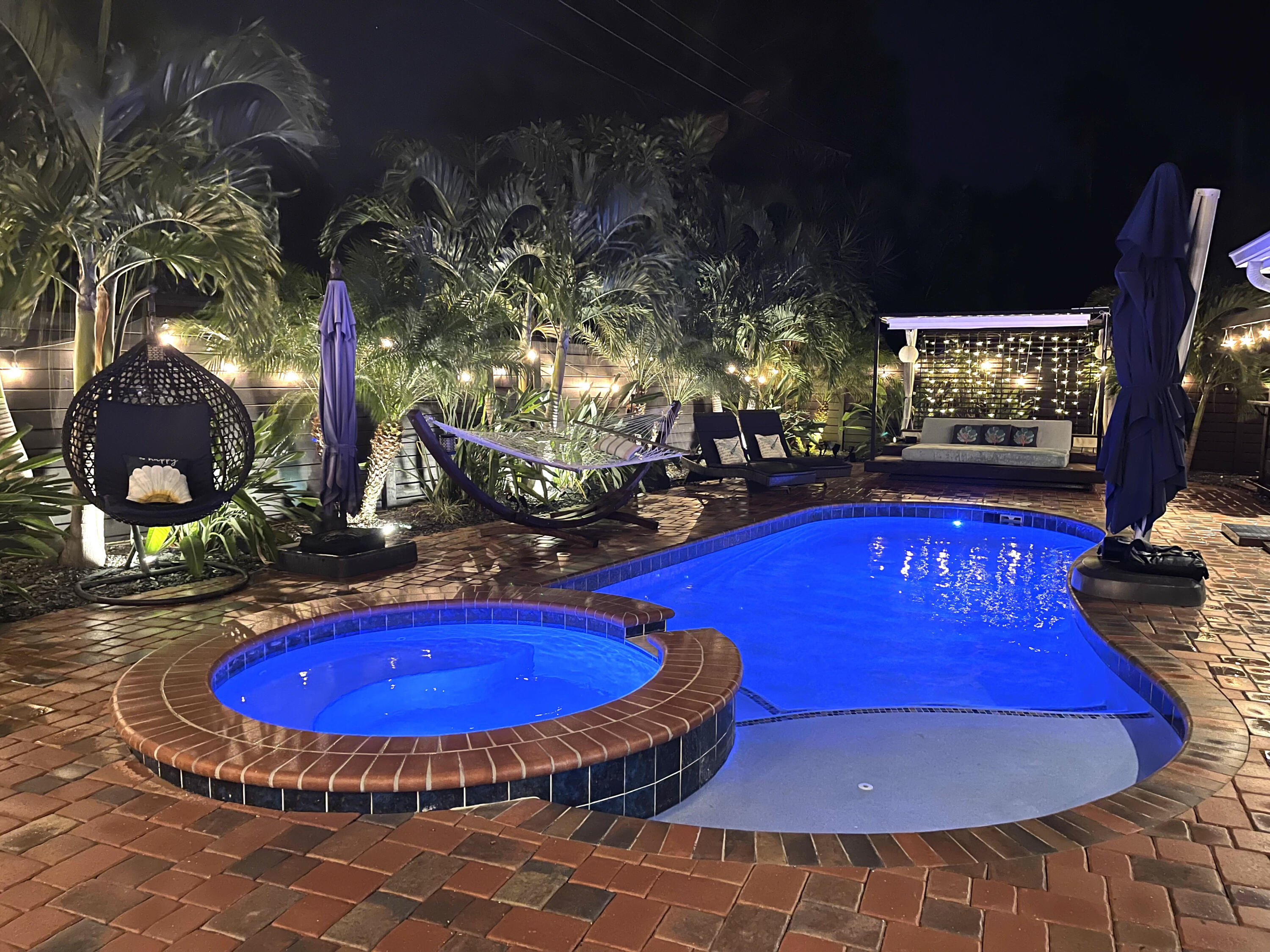 a view of a swimming pool with sitting area