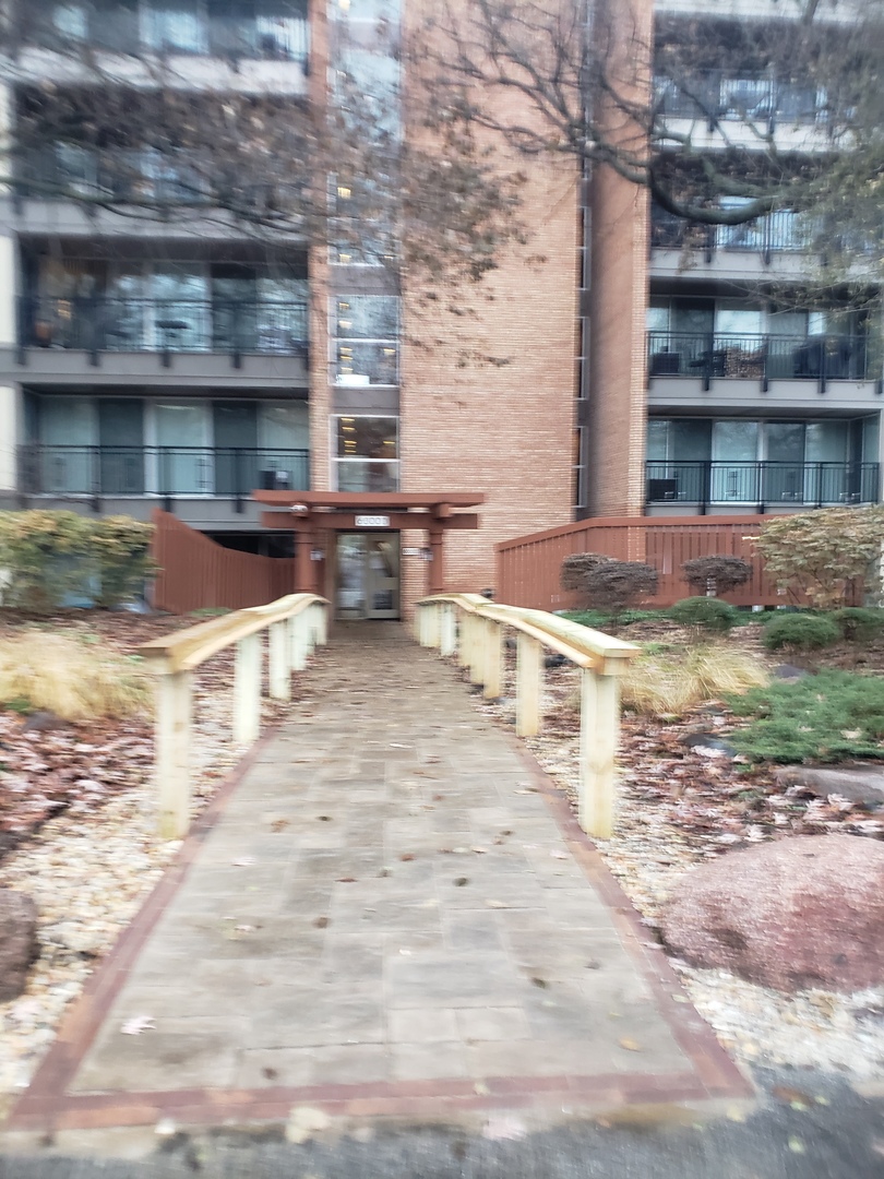 a view of a swimming pool with outdoor seating