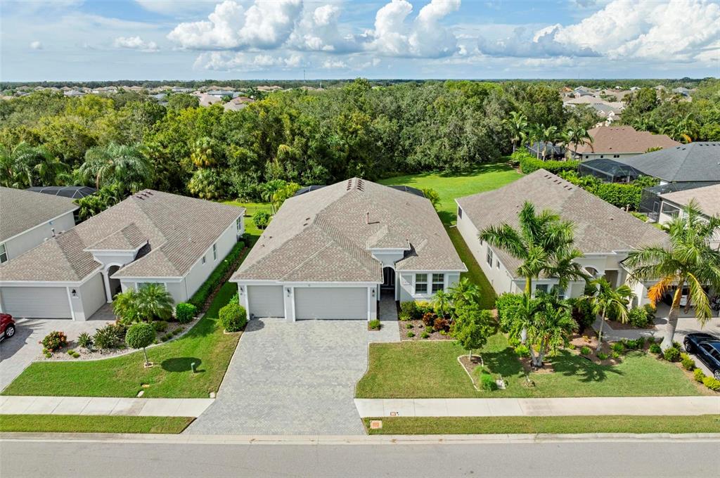 a aerial view of a house with a yard and plants