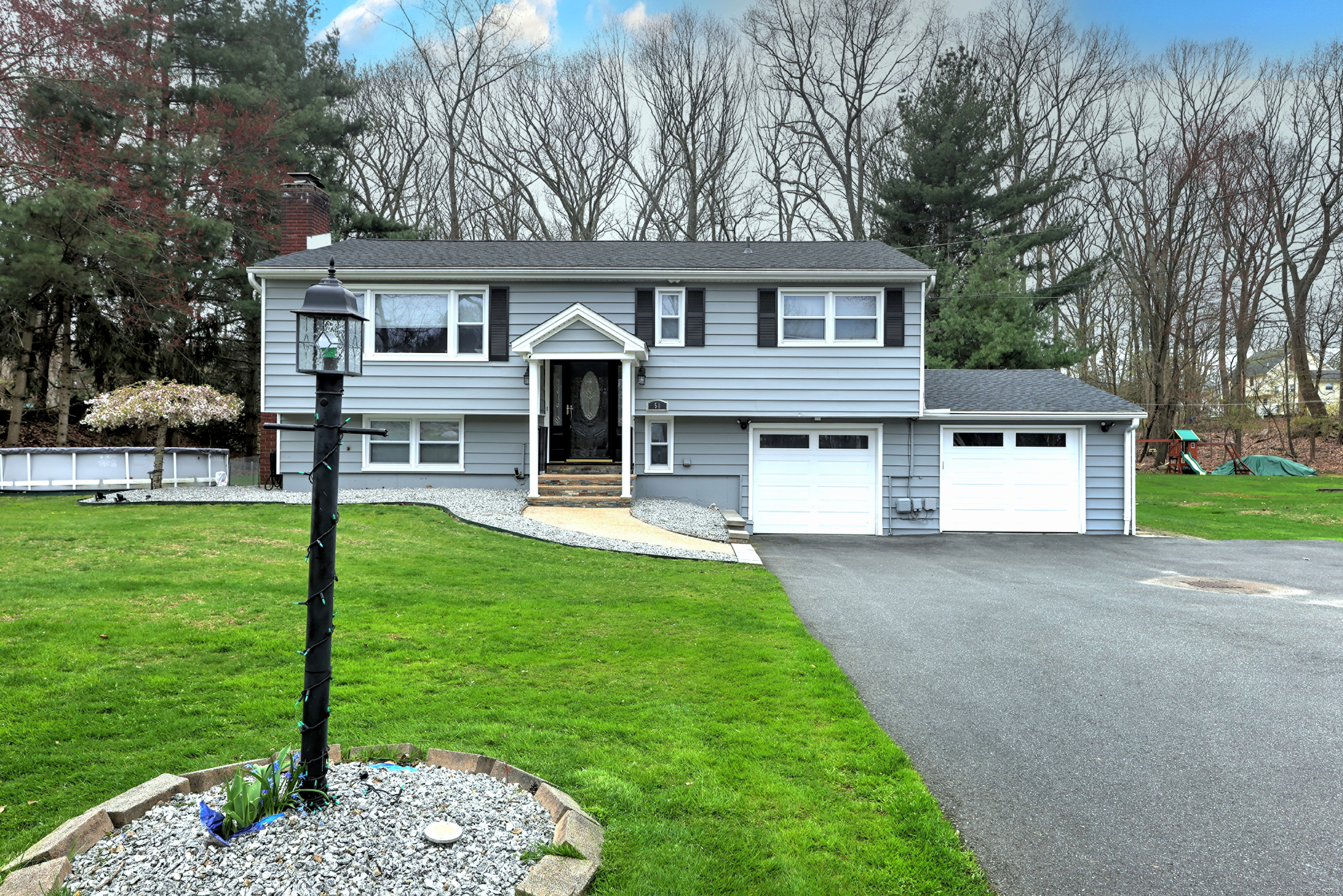 front view of a house with a yard