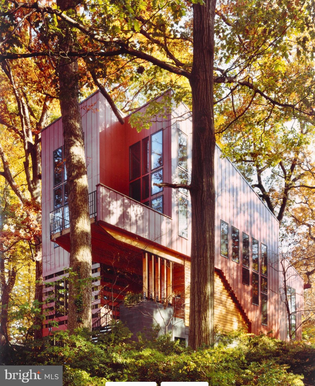 front view of a building with a tree