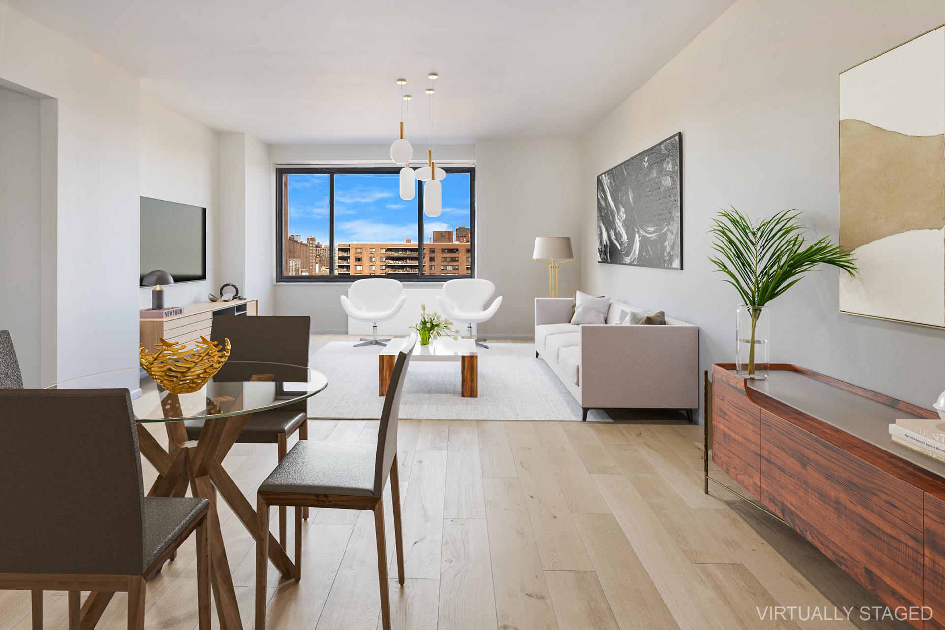 a living room with furniture and a potted plant