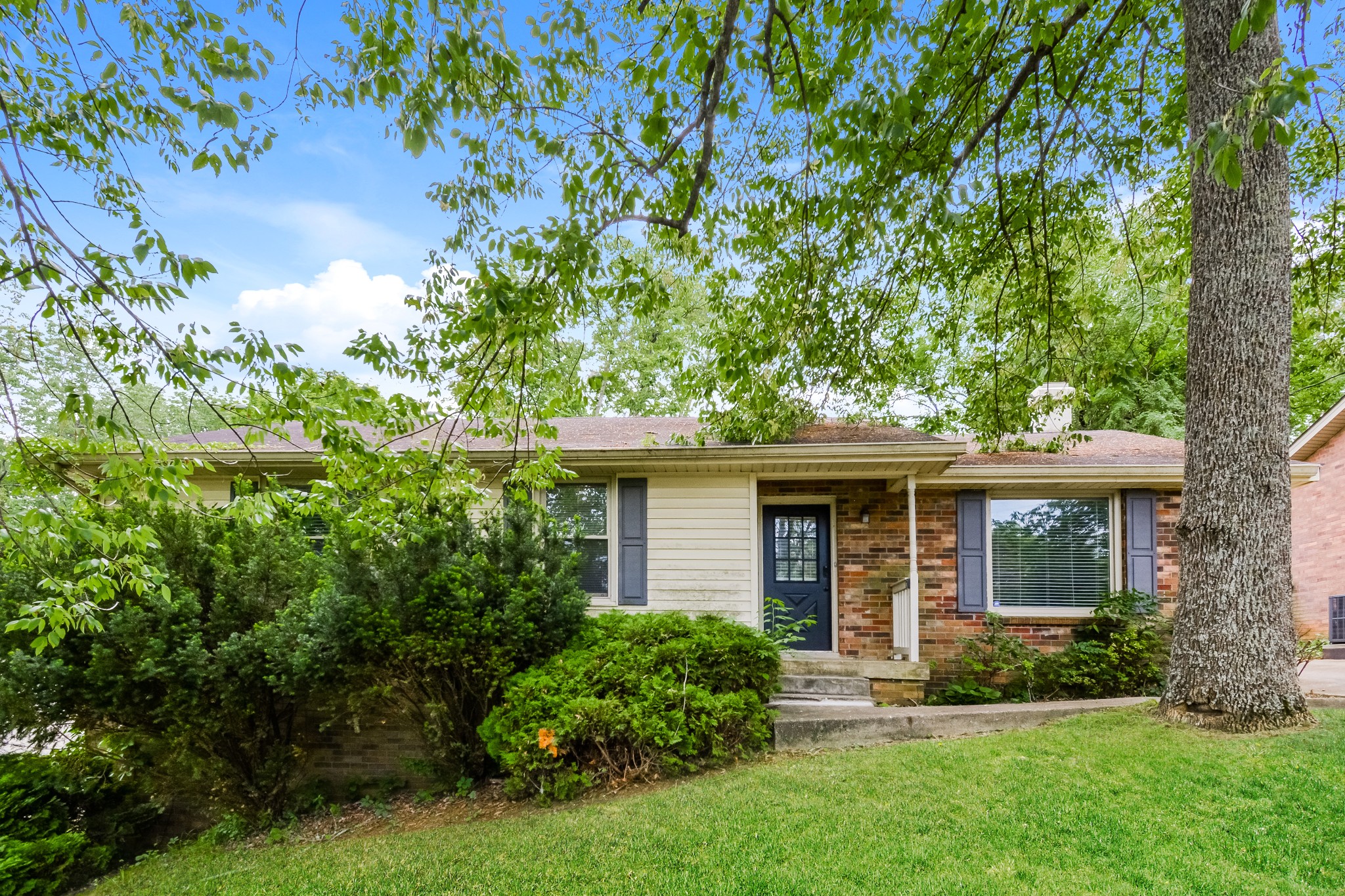 front view of a house with a yard