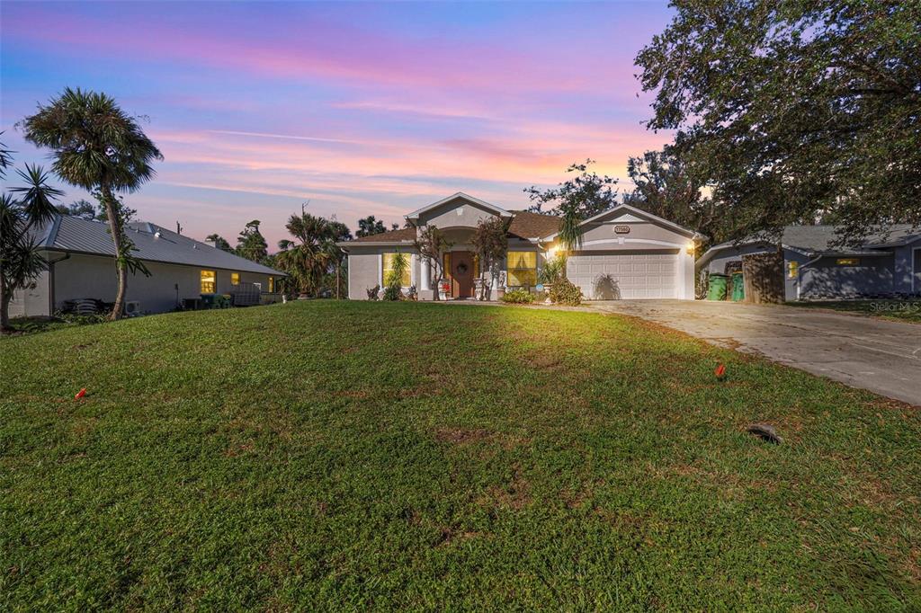 a view of a house with a yard