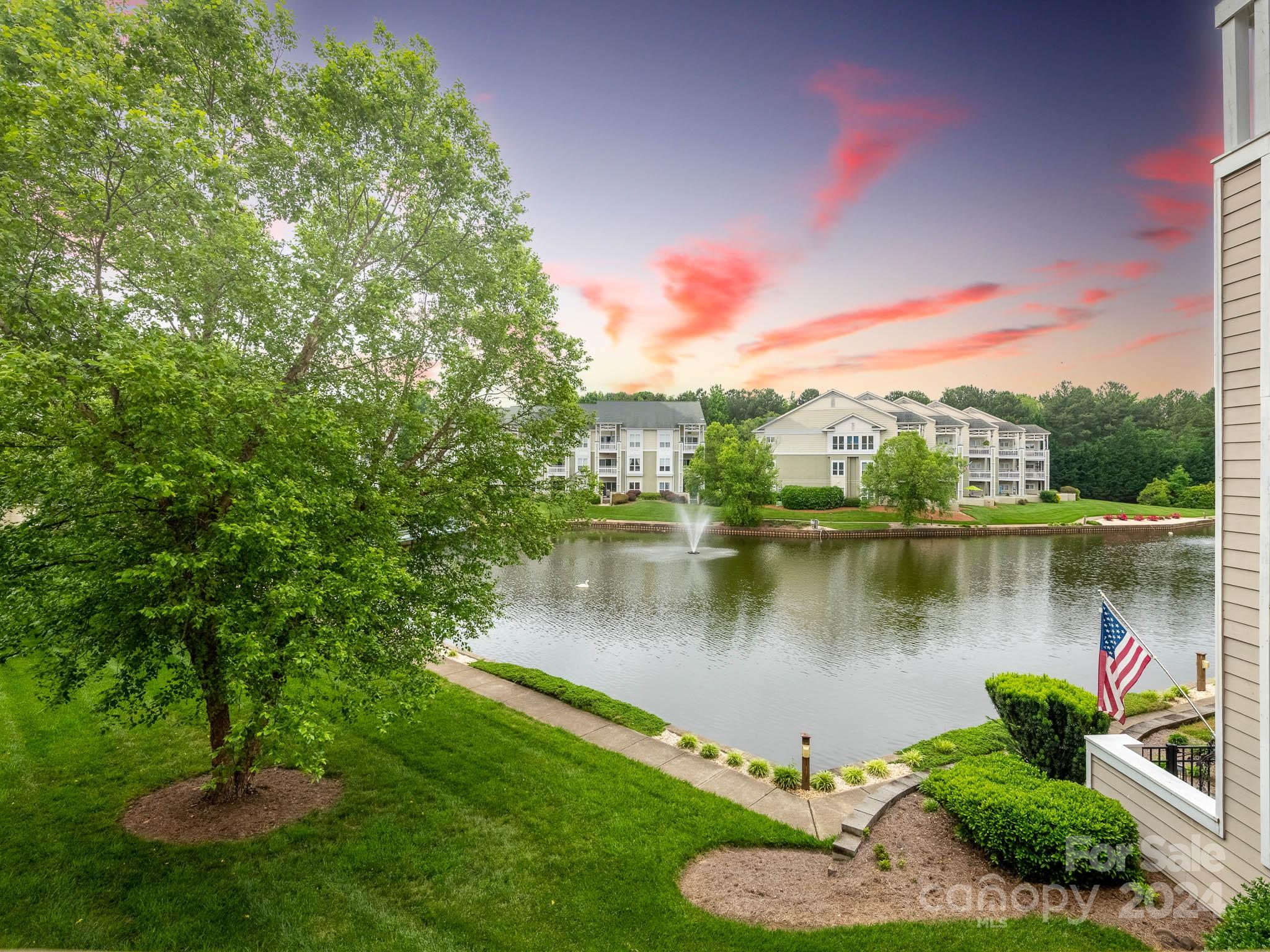 a view of a lake with a yard