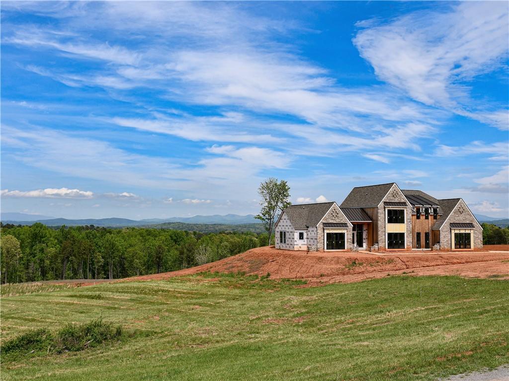 a white house with a big yard