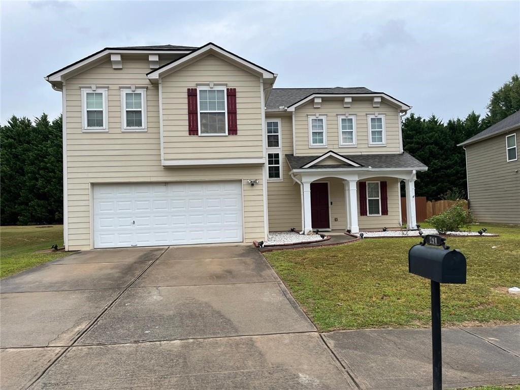 a front view of a house with yard