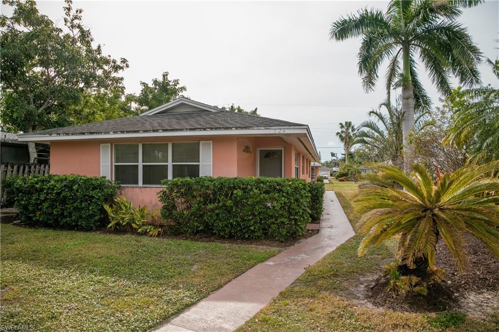 Bungalow-style home featuring a front yard