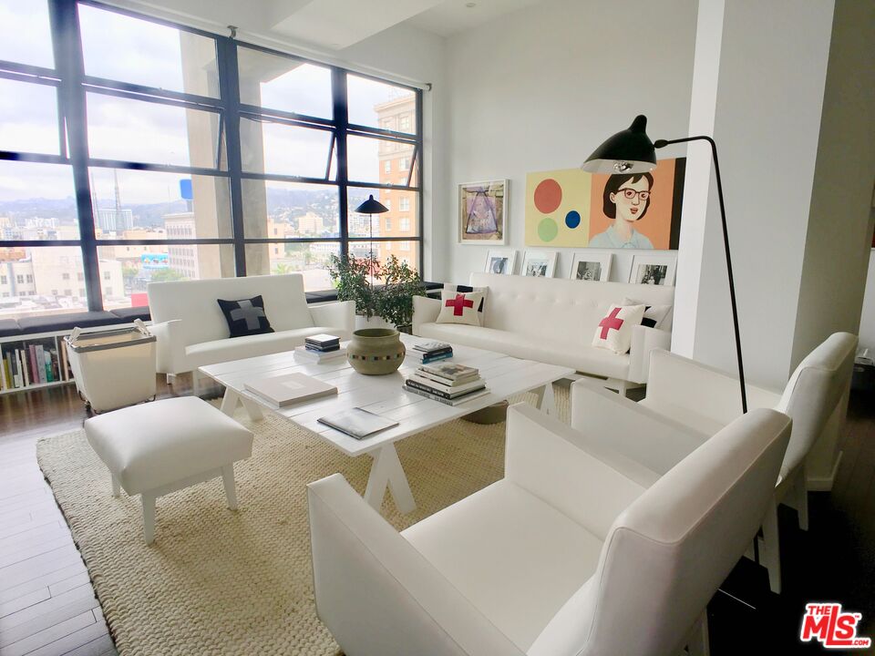 a dining room with furniture and a window