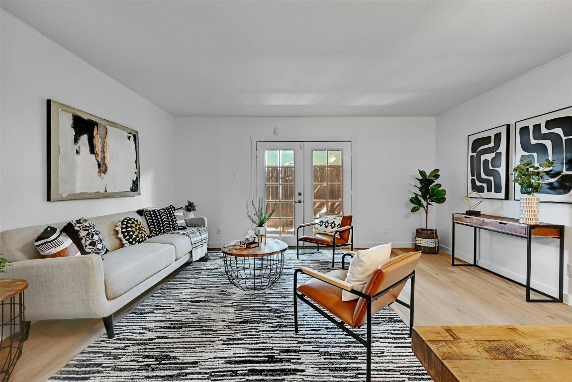 Spacious living area with fresh paint and white oak luxury vinyl plank installed