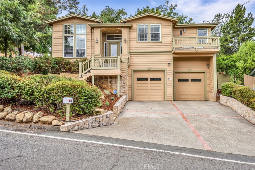 a view of a house with a yard and garage