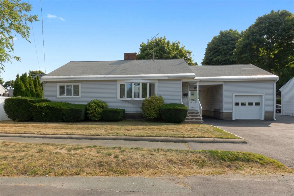 a front view of a house with garage