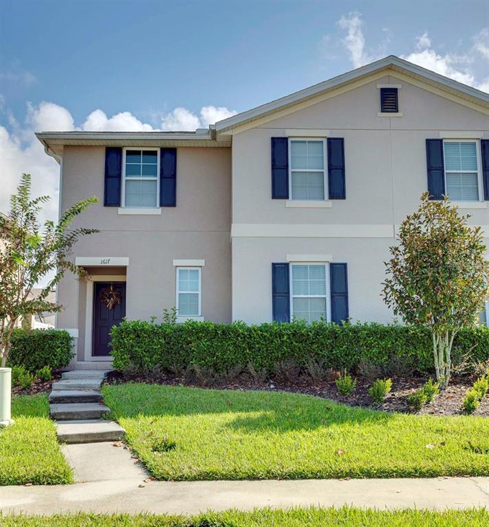 a front view of a house with a yard