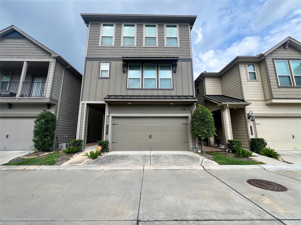 a front view of a house with garage