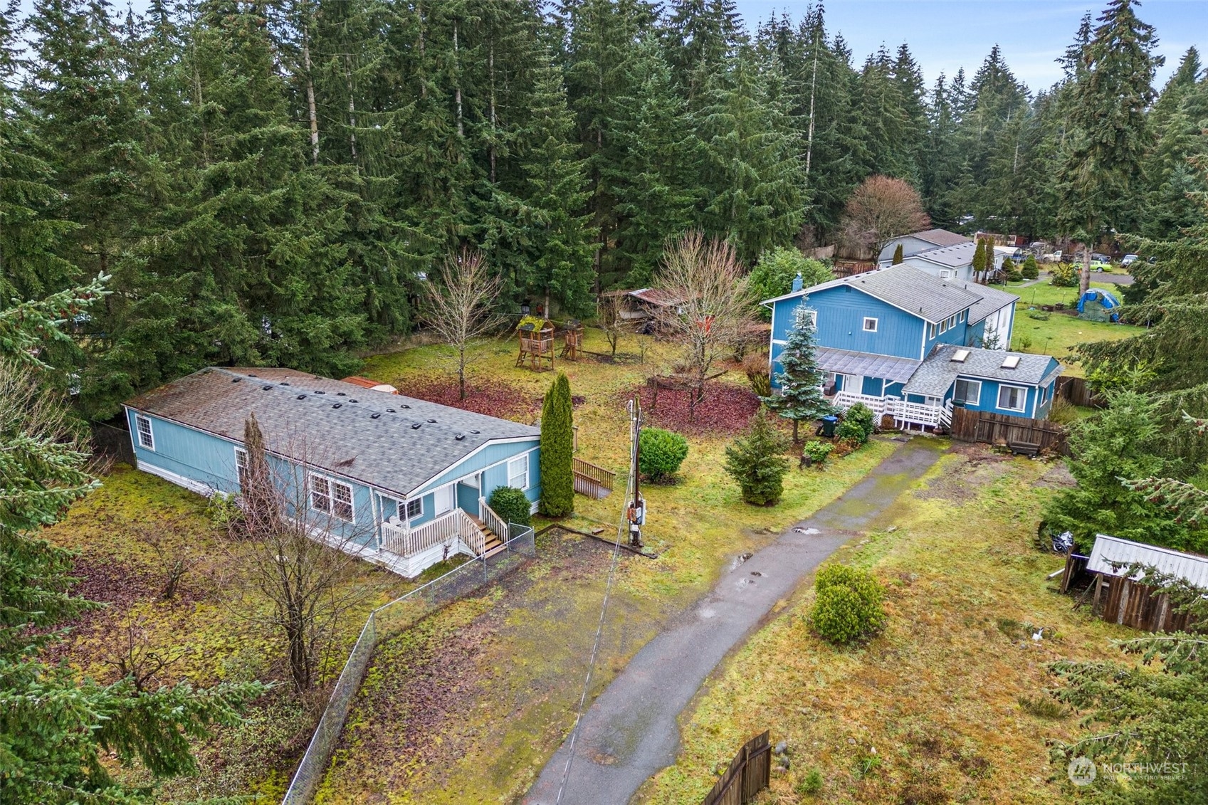 an aerial view of a house with a garden